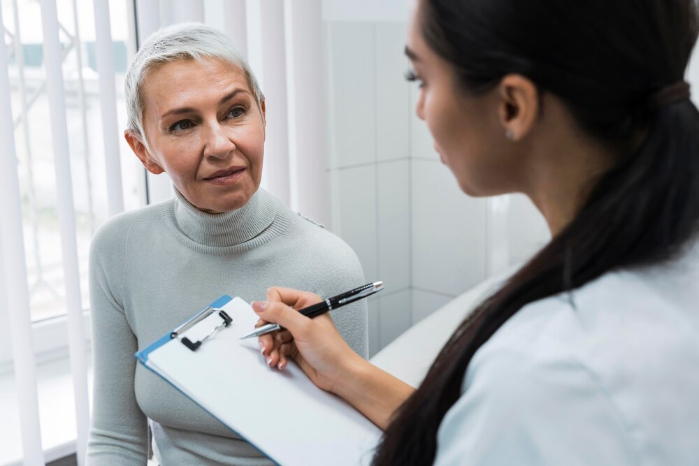 Doctor taking notes about a patient
